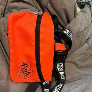 Looks orange but it's a bright pink Fanny pack